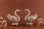Load image into Gallery viewer, Pair of 999 pure silver swan earrings by Rasava Jewels, detailed handcrafted jewelry with sleek silver finish.