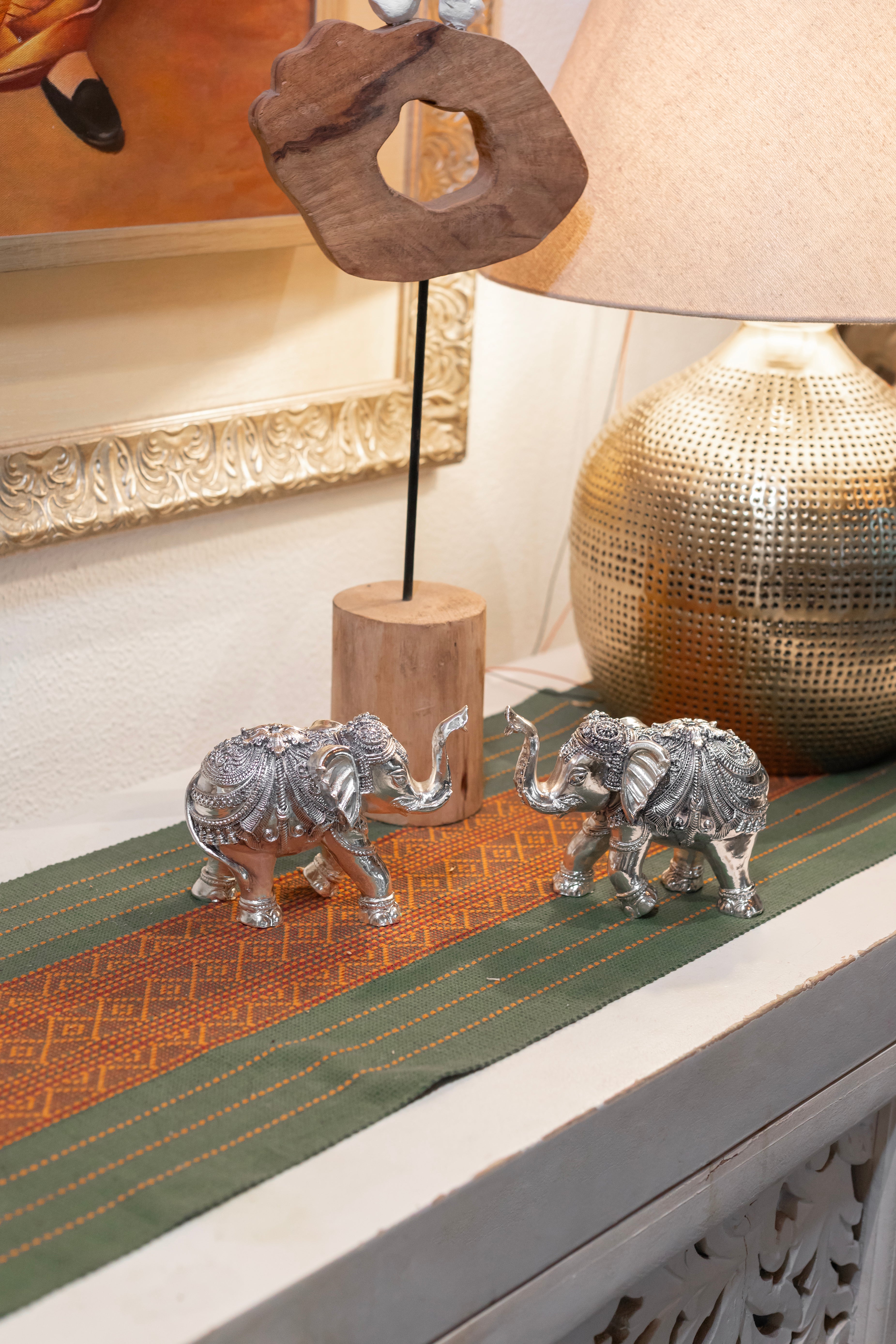 Pair of 999 pure silver elephant earrings by Rasava Jewels, detailed elephant design with engraved features.