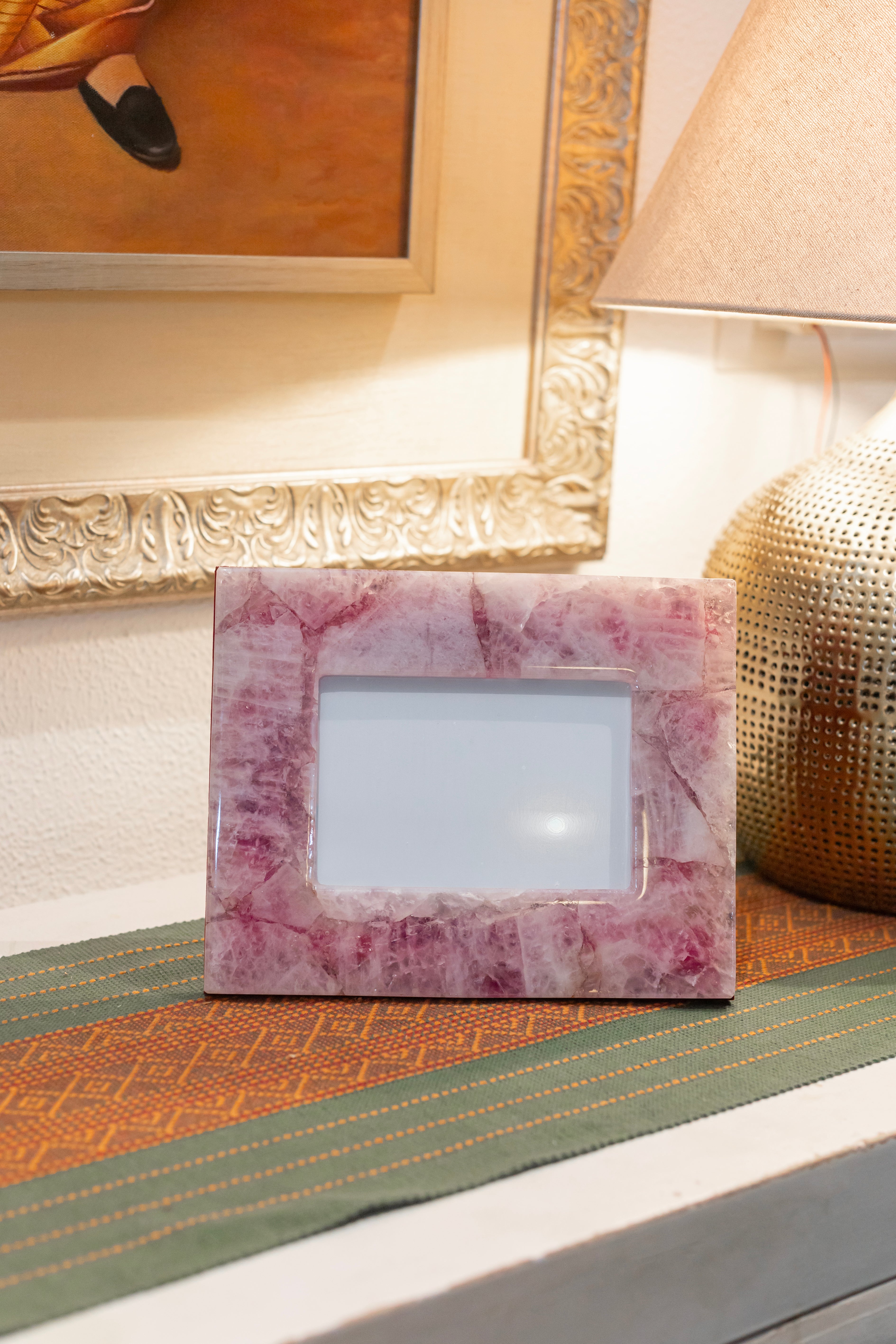 Natural rose quartz photo frame by Rasava Jewels featuring a polished pink gemstone border for decorative display.