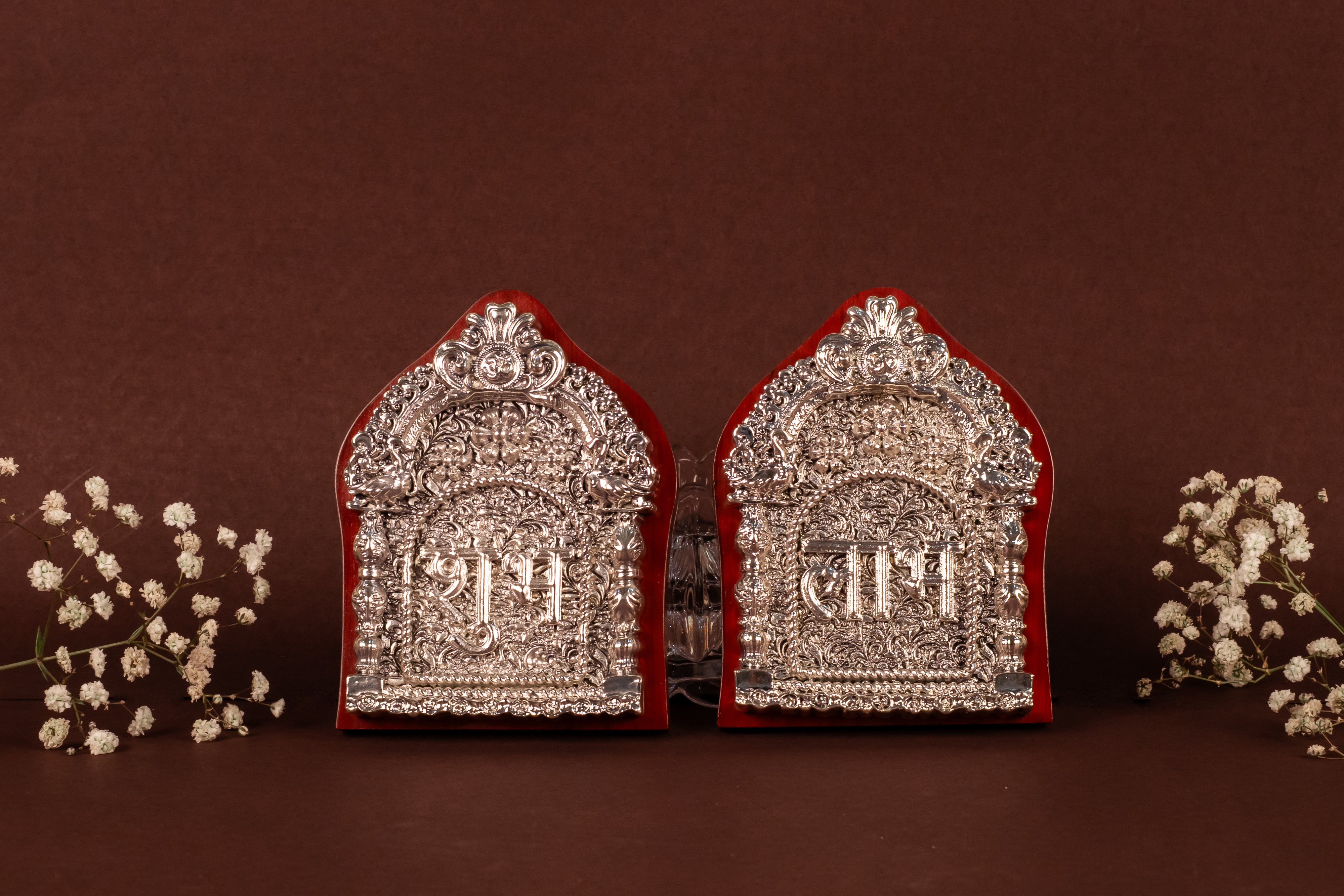 Pure silver Shubhh Labh pendant by Rasava Jewels, featuring intricate traditional design on shiny silver surface.