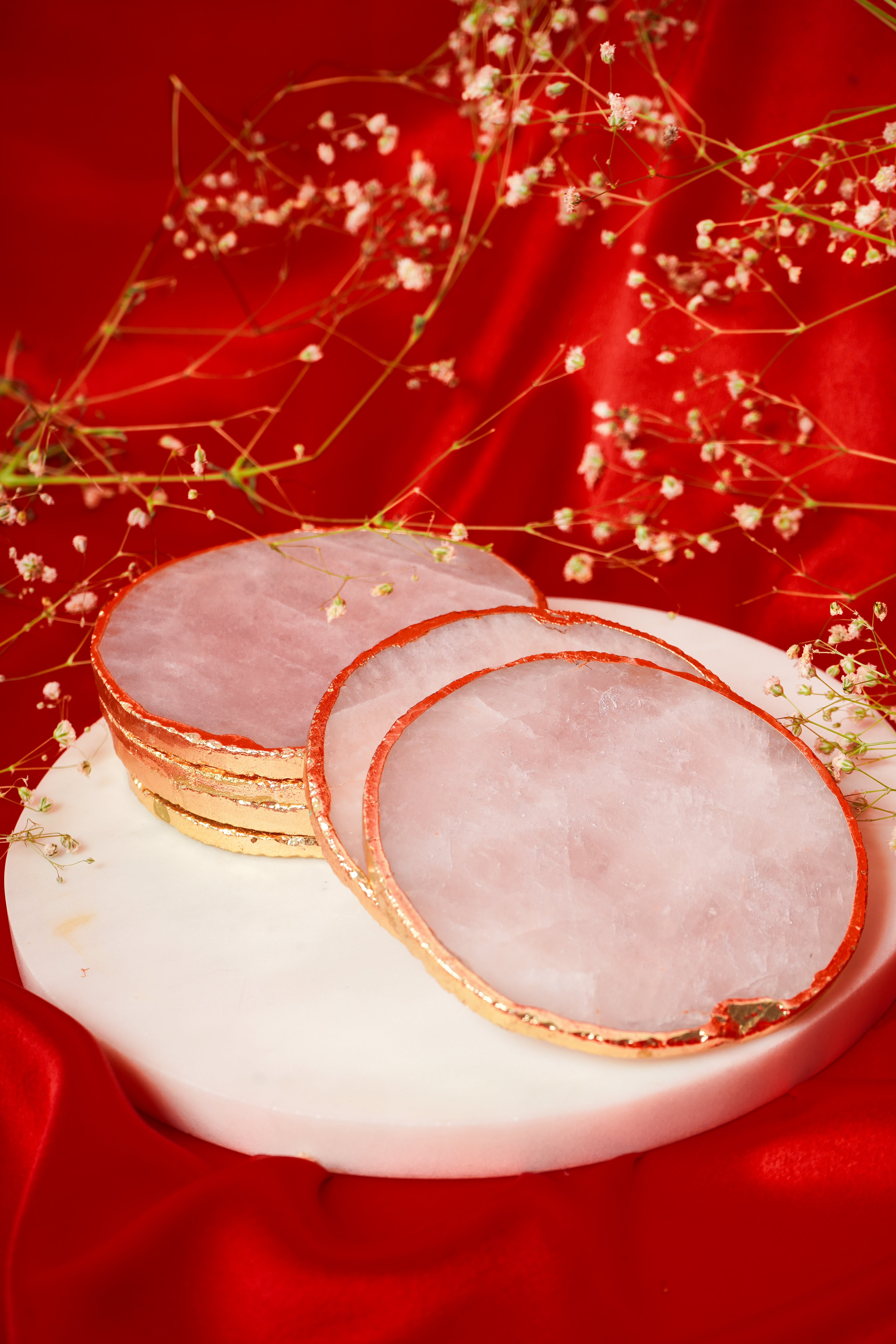Set of natural rose quartz coasters from My Store, available in sets of 2, 4, 6, or 8, featuring polished pink stone surfaces.