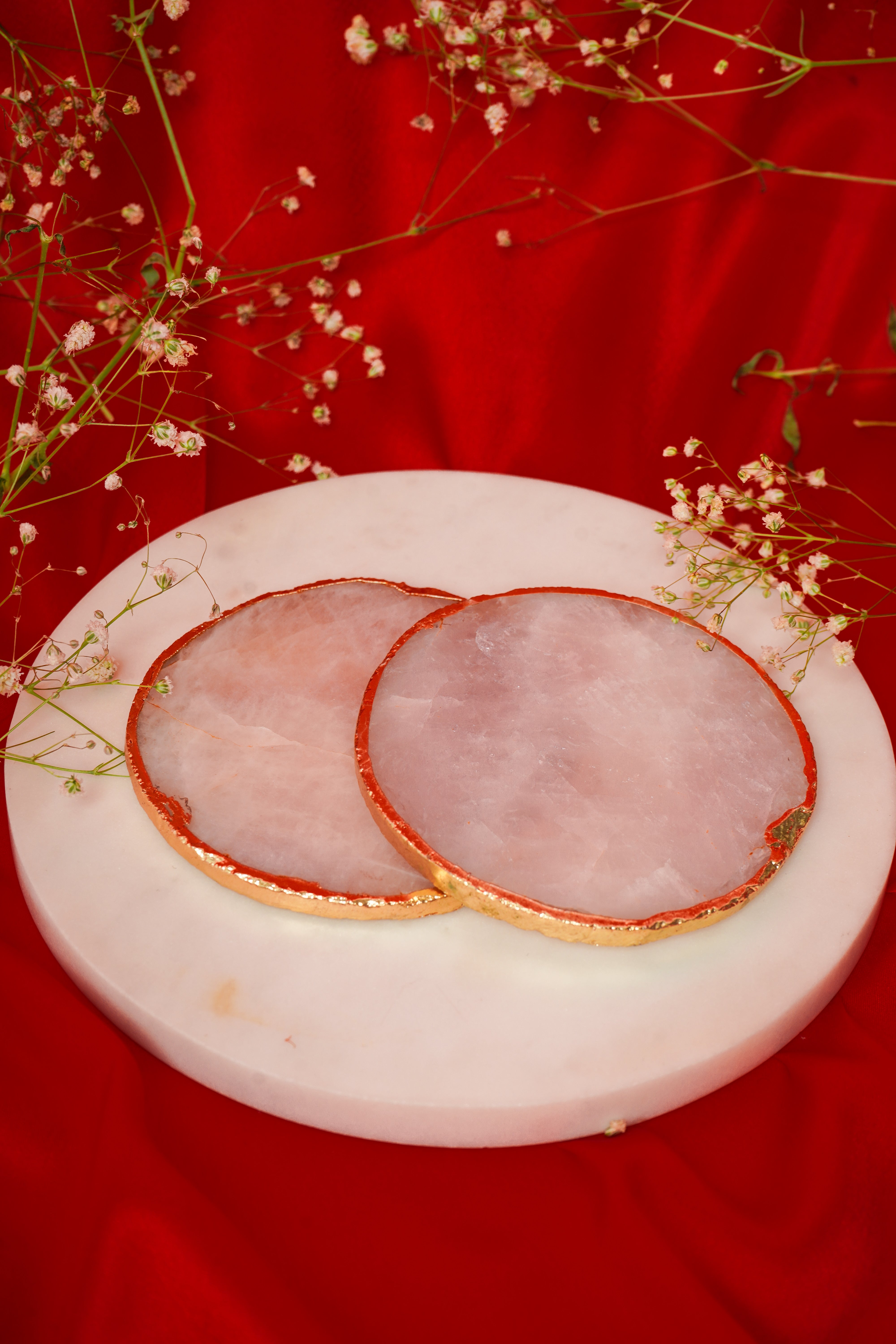 Set of natural rose quartz coasters from My Store, showcasing smooth, pink gemstone surfaces for protecting surfaces.