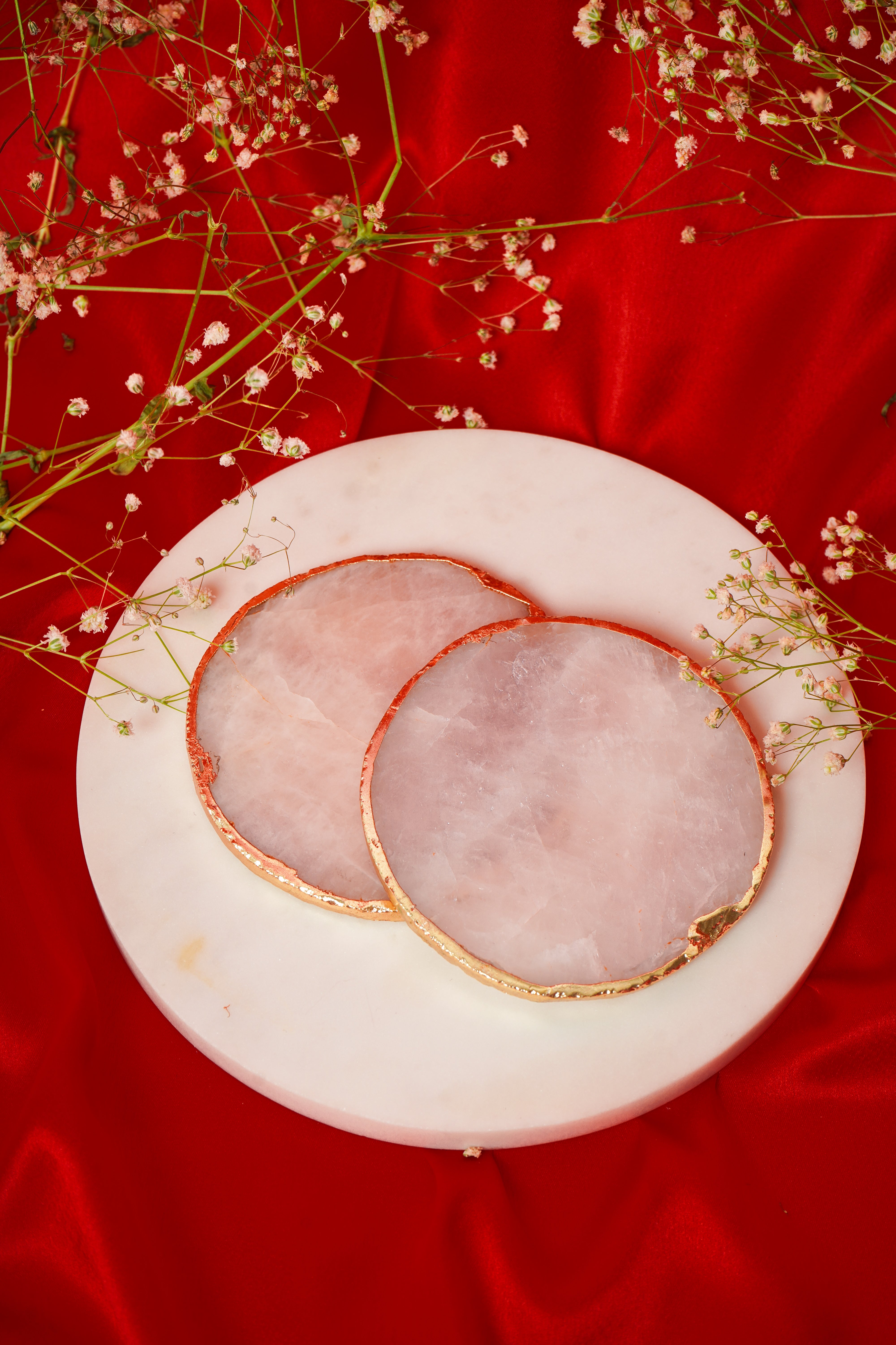 Set of natural rose quartz coasters from My Store, showcasing smooth pink stone surfaces in a matching set of 2, 4, 6, or 8.