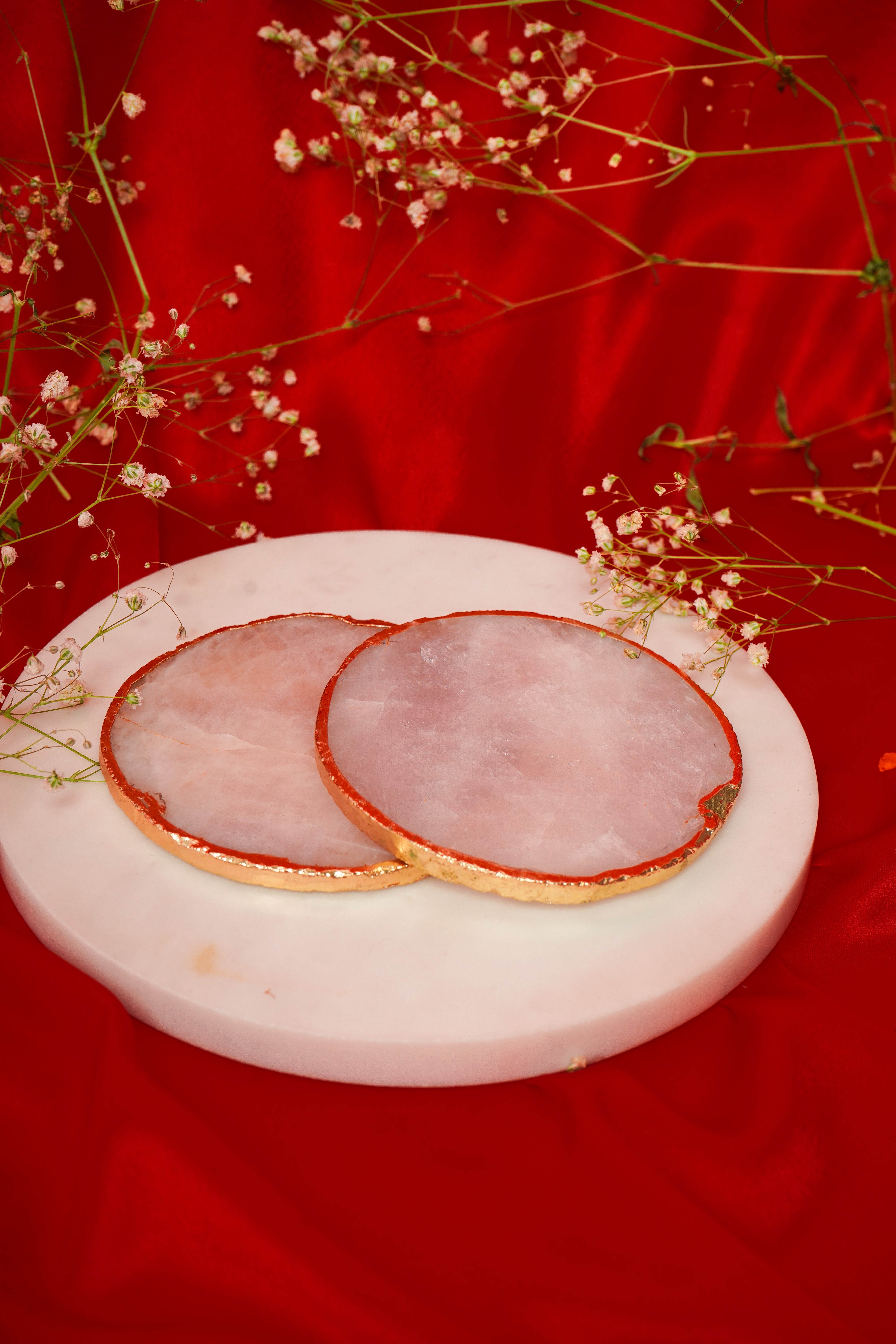 Set of natural rose quartz coasters from My Store, showcasing smooth pink gemstone surfaces in a multi-piece set.