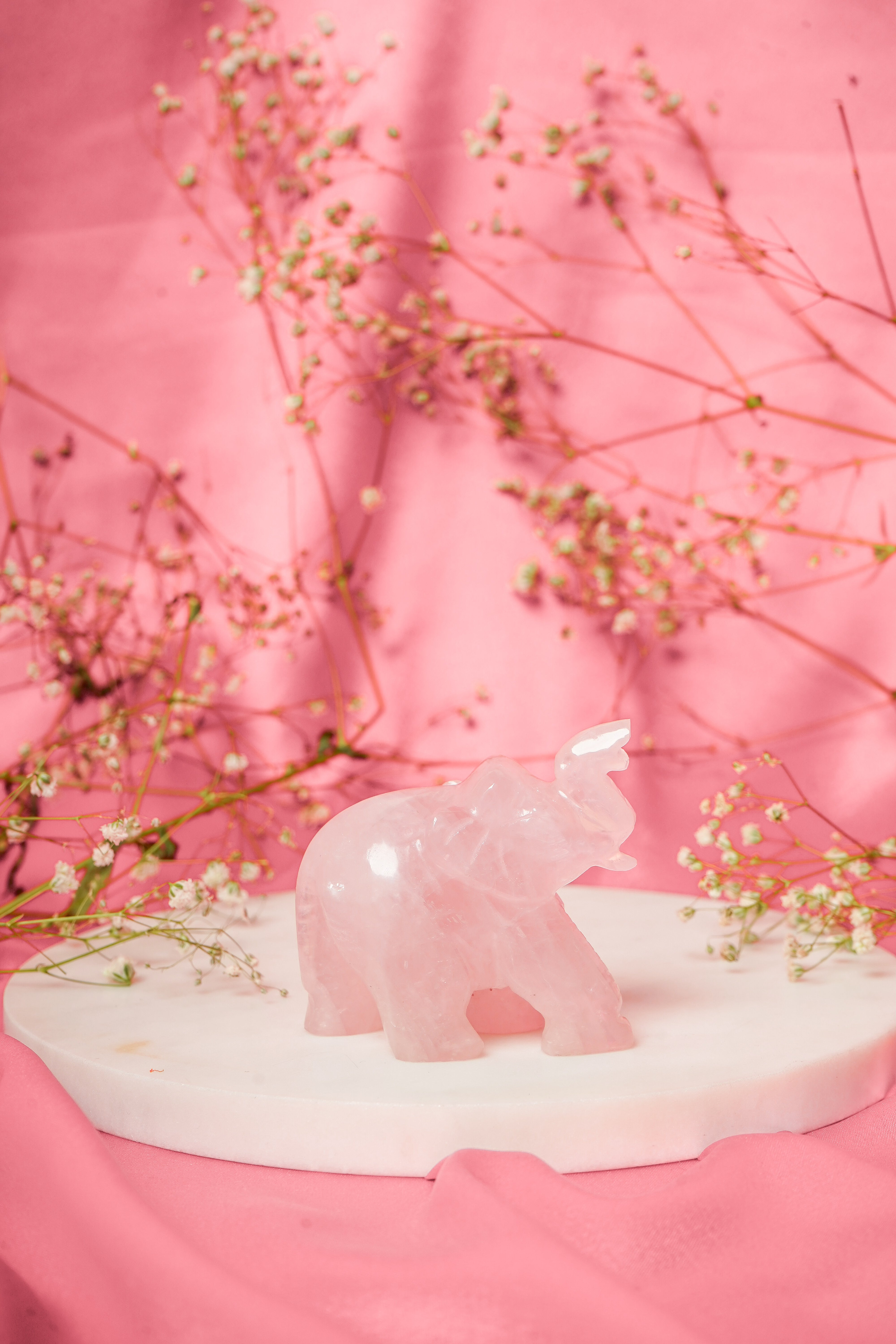 Natural rose quartz elephant figurine with smooth polished surface, representing elegance and serenity, from My Store.