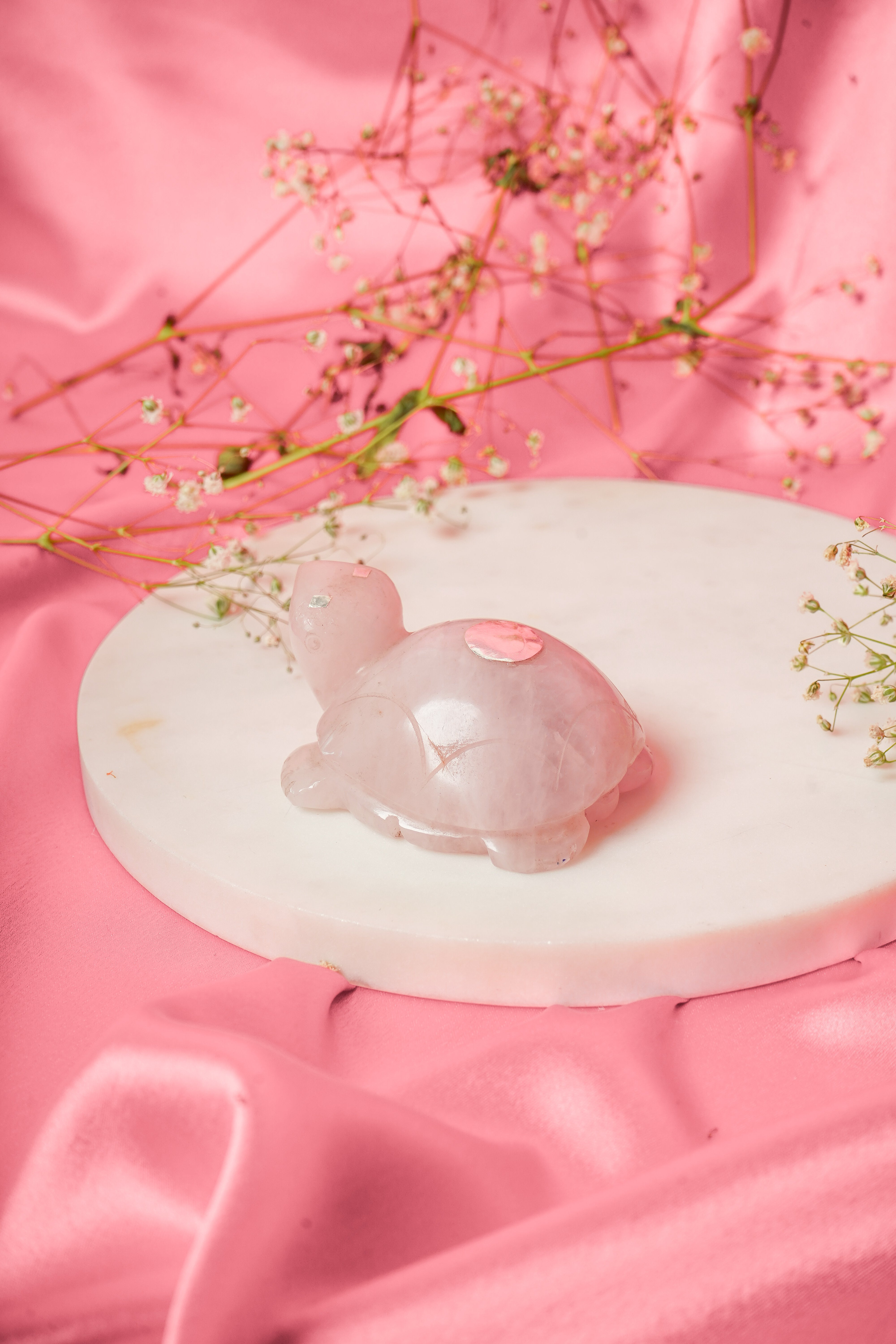 Natural rose quartz tortoise sculpture with silver accents, showcasing a polished pink quartz body and detailed silver shell.