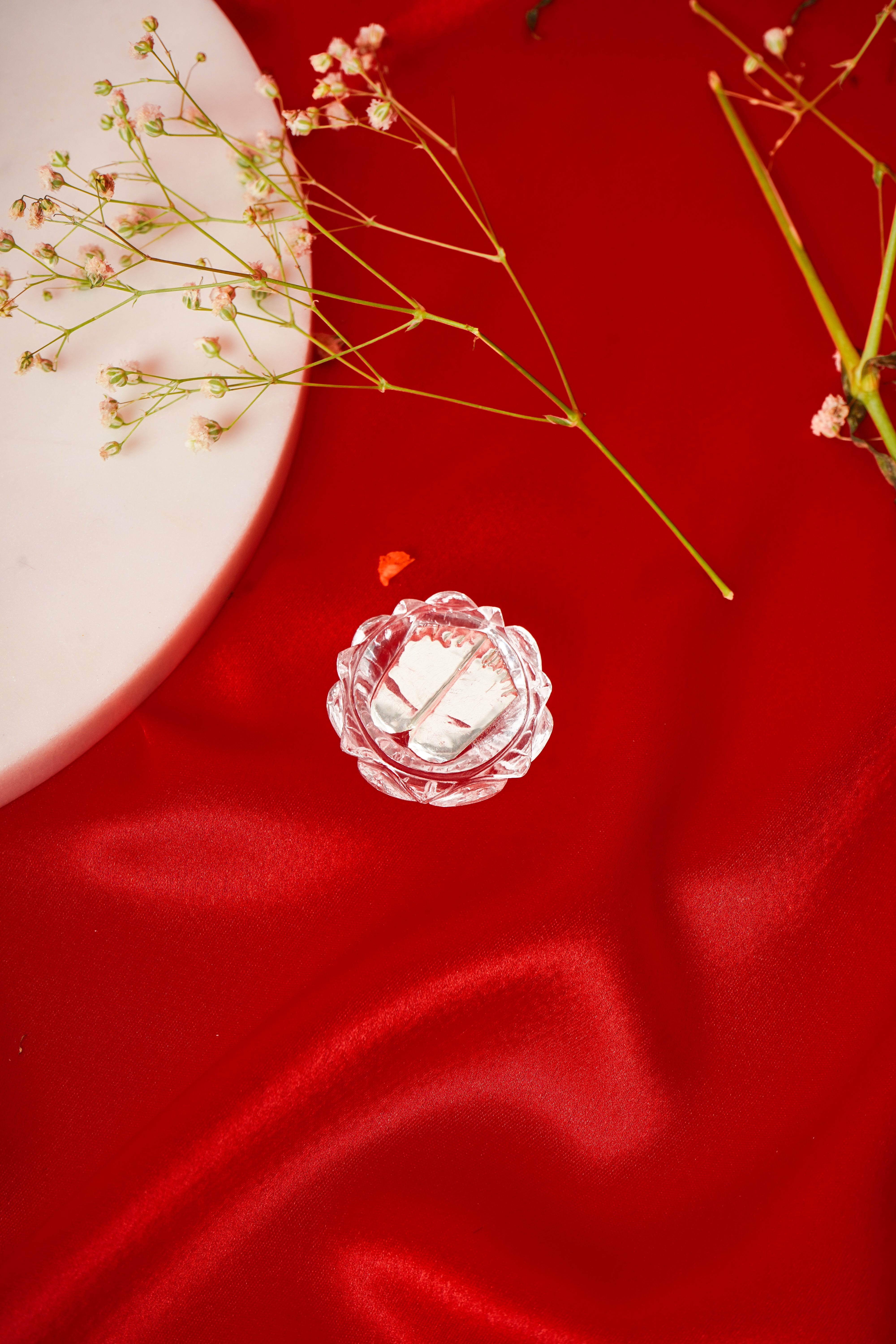 Natural clear quartz Charan Paduka with silver accents, traditional Indian footwear featuring intricate silver detailing.