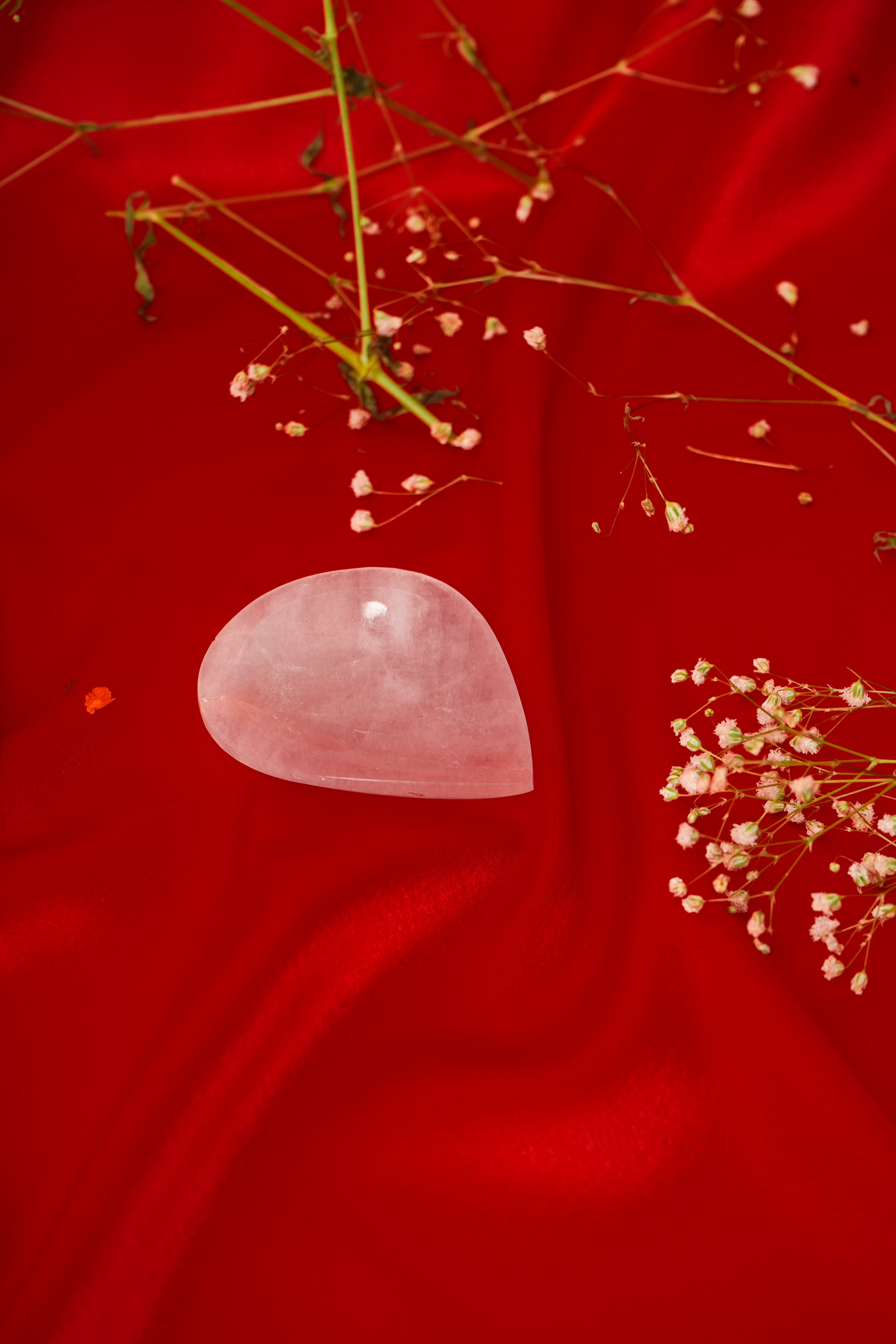 Natural rose quartz diya with intricate carvings, perfect for decorative or spiritual use.