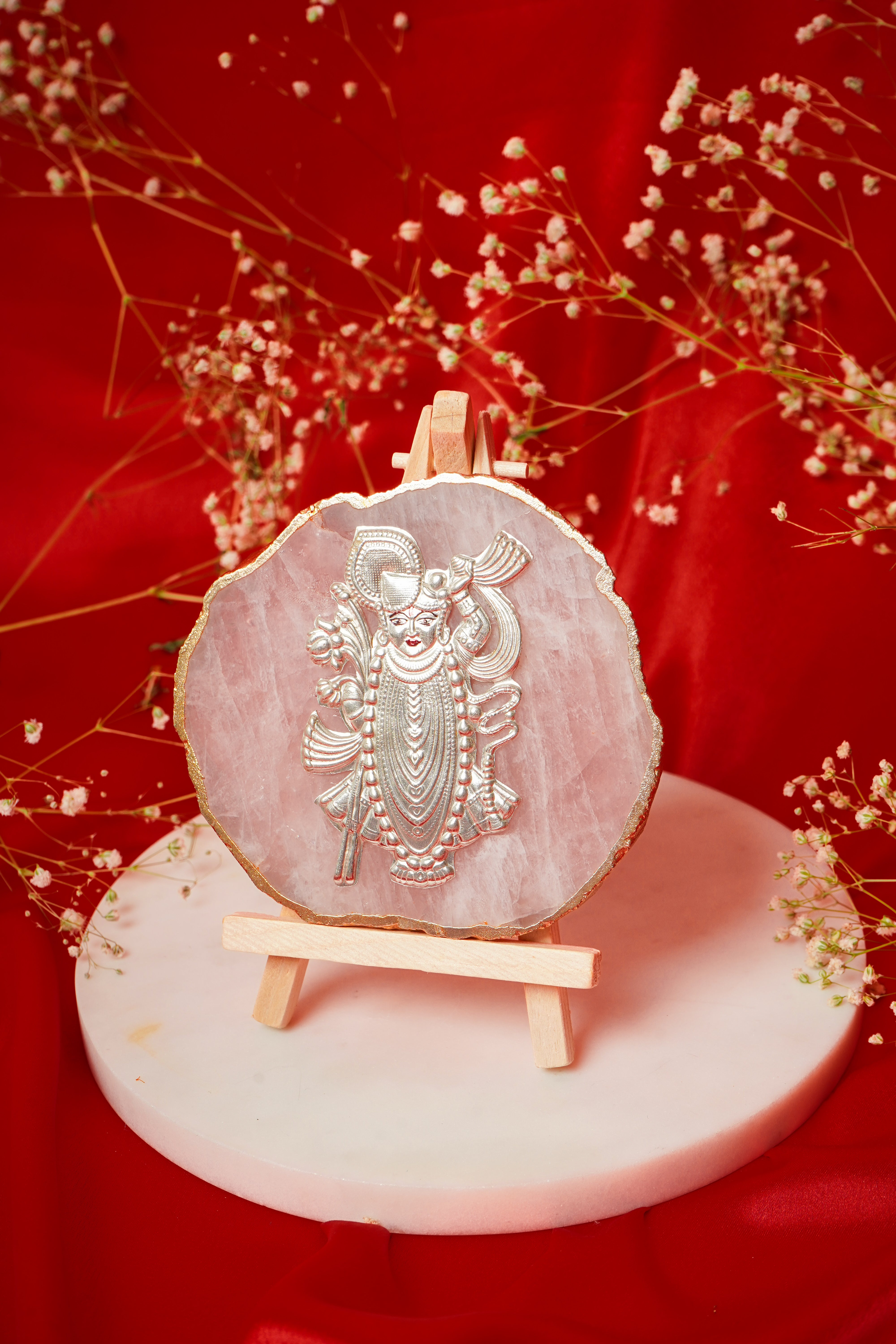 Natural rose quartz coaster featuring Shrinath Ji in pure silver, showcasing intricate craftsmanship and vibrant pink gemstone details.