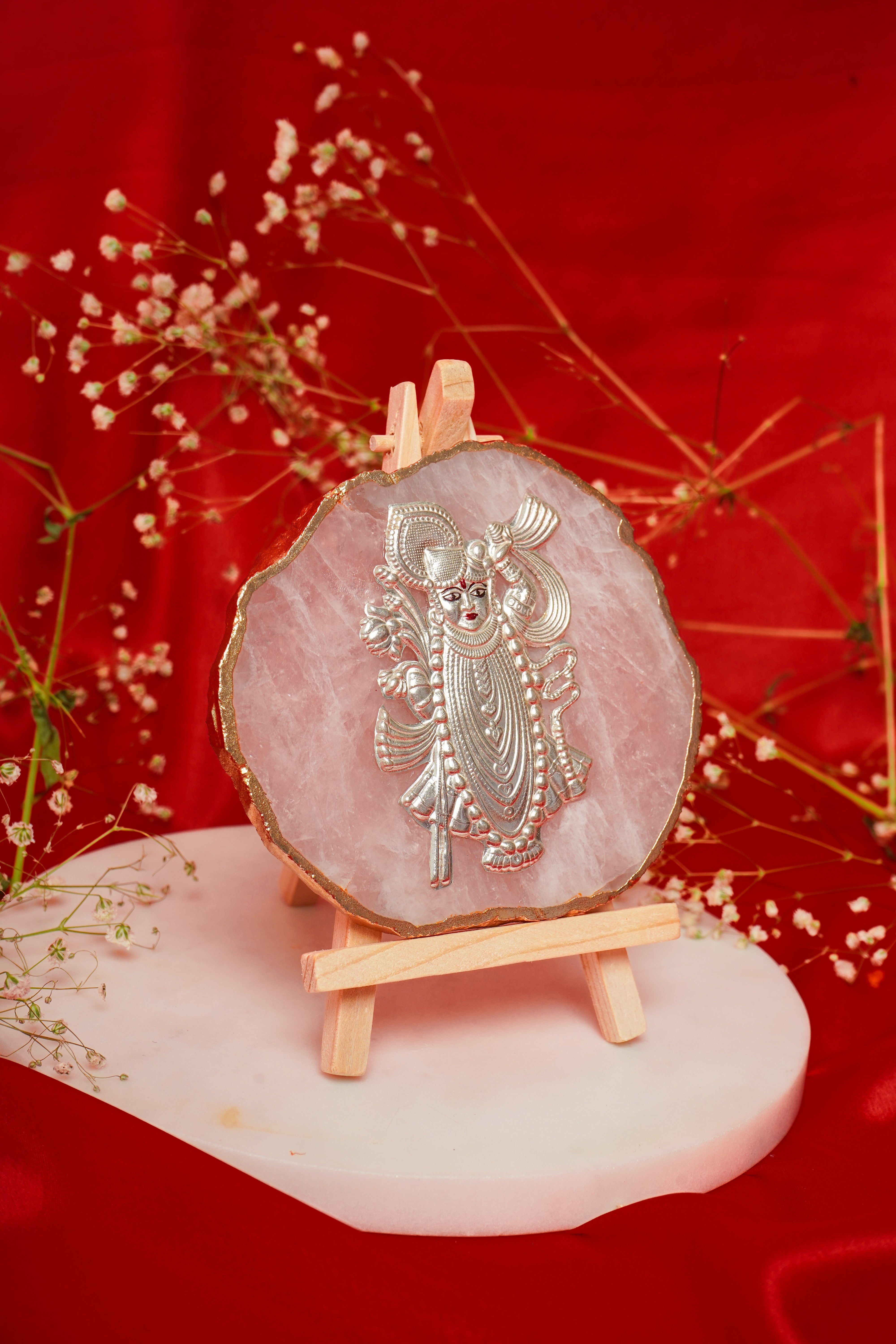 Natural rose quartz coaster featuring Shrinath ji in pure silver, crafted for elegant home decor and spiritual ambiance.