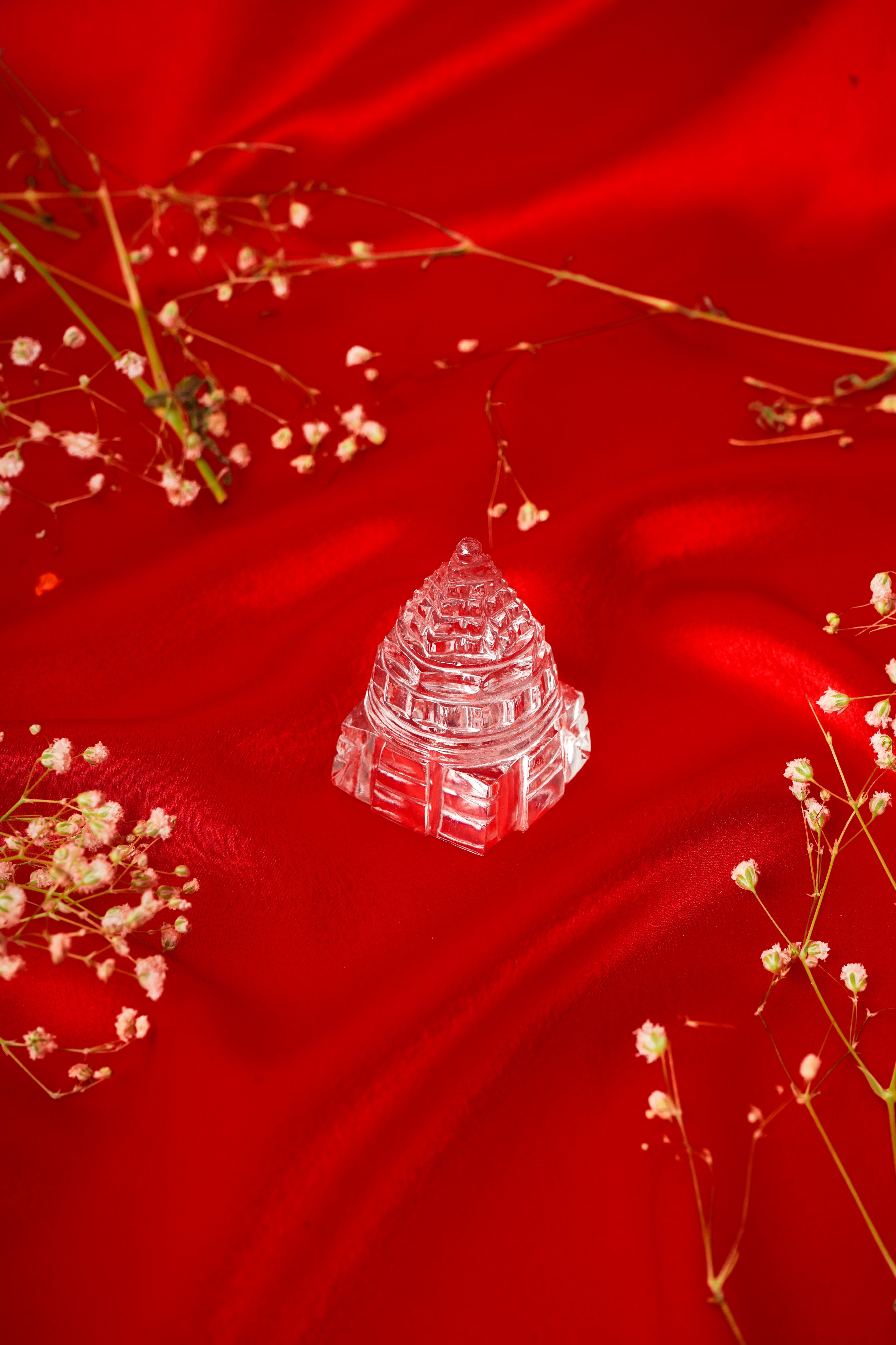 Natural clear quartz Shree Yantra pendant with intricate geometric design, crafted from transparent, polished quartz stone.