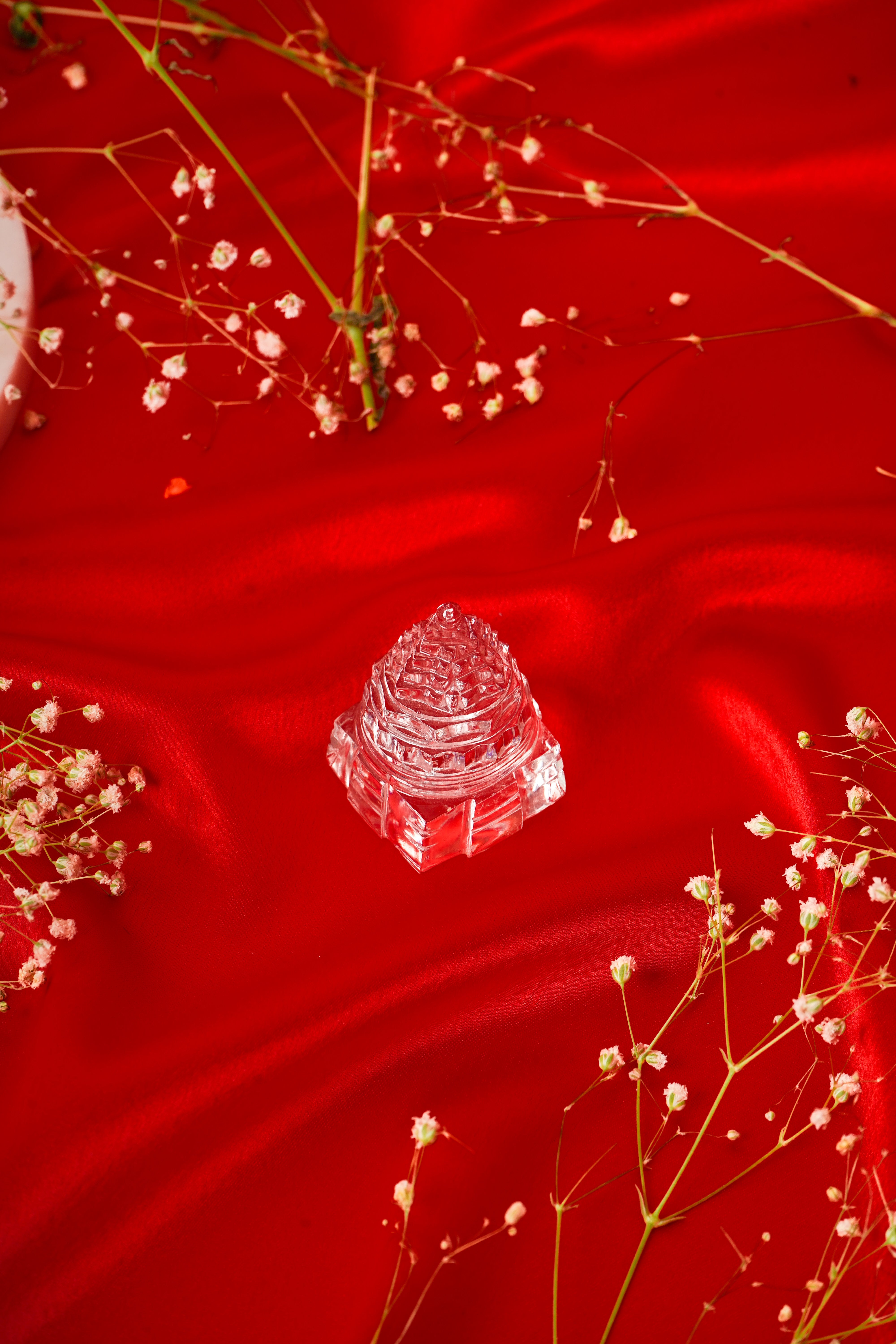 Natural clear quartz Shree Yantra gemstone with intricate geometric design for spiritual and decorative use.