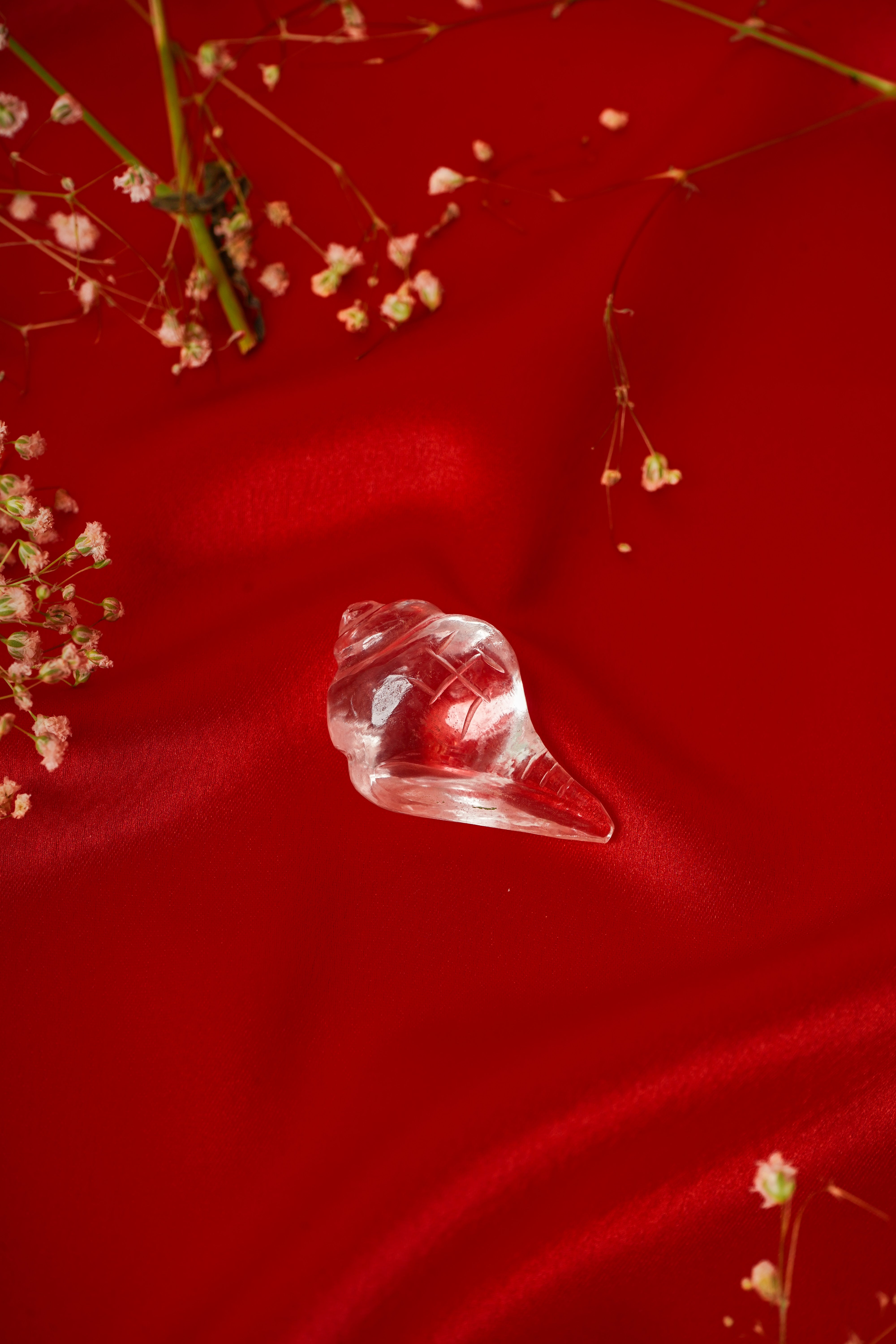 Clear quartz shankh from My Store featuring a natural, polished shell with smooth surface and intricate shell details.