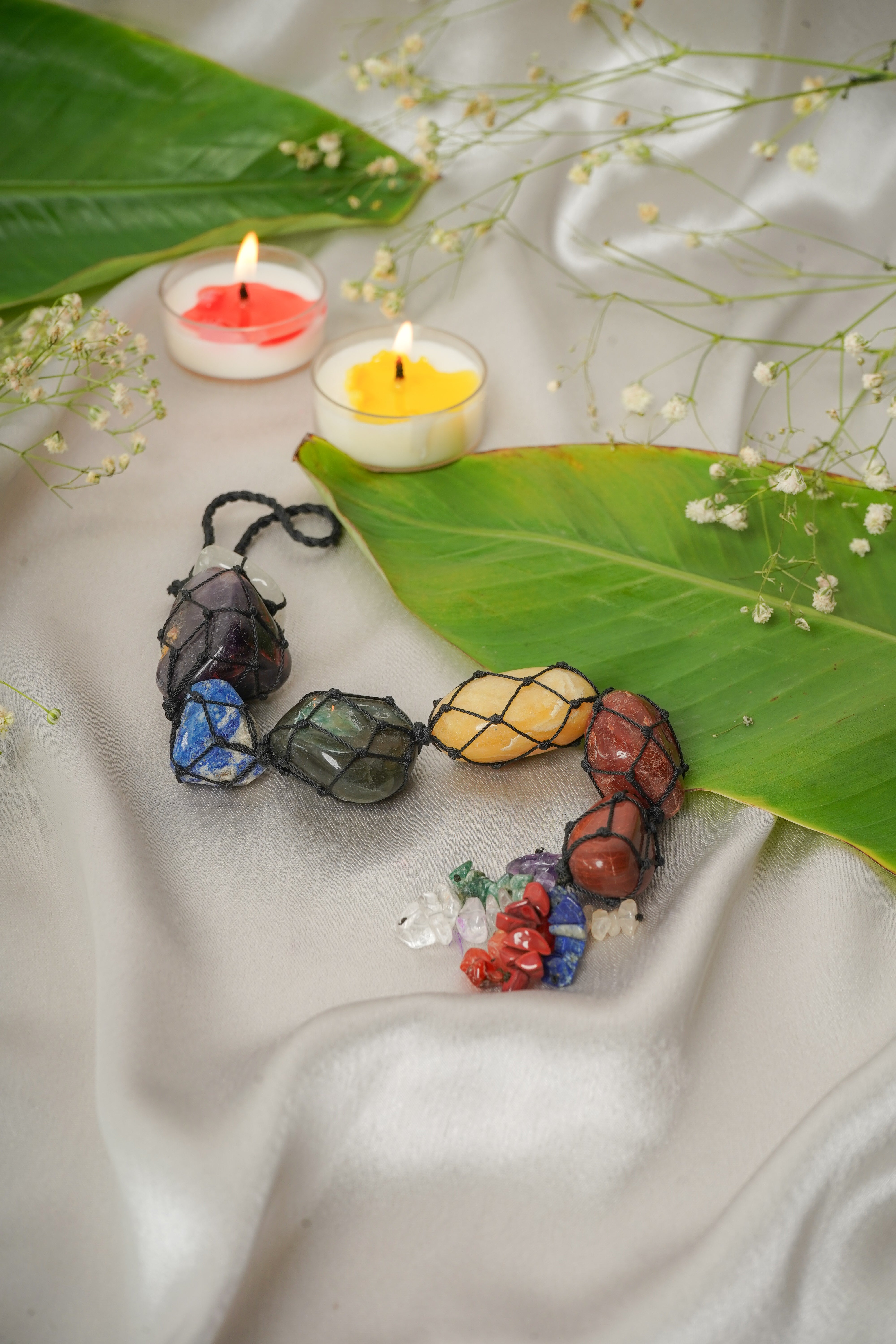 Seven chakra natural stone wall hanging featuring colorful chakra gemstones and intricate design for spiritual decor.