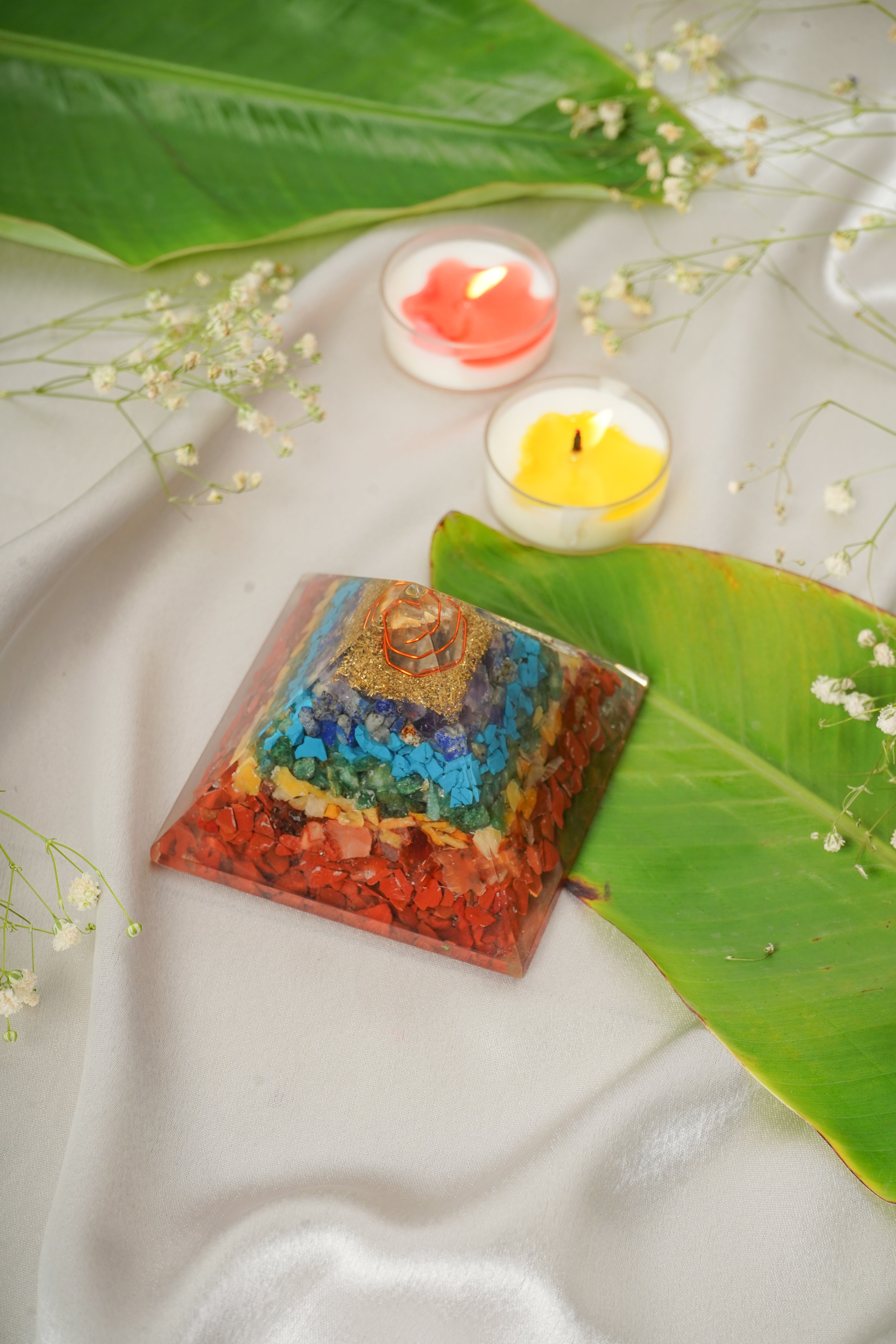 Seven chakra natural stone pyramid from My Store, featuring colorful polished stones arranged in a pyramid shape for positive energy.