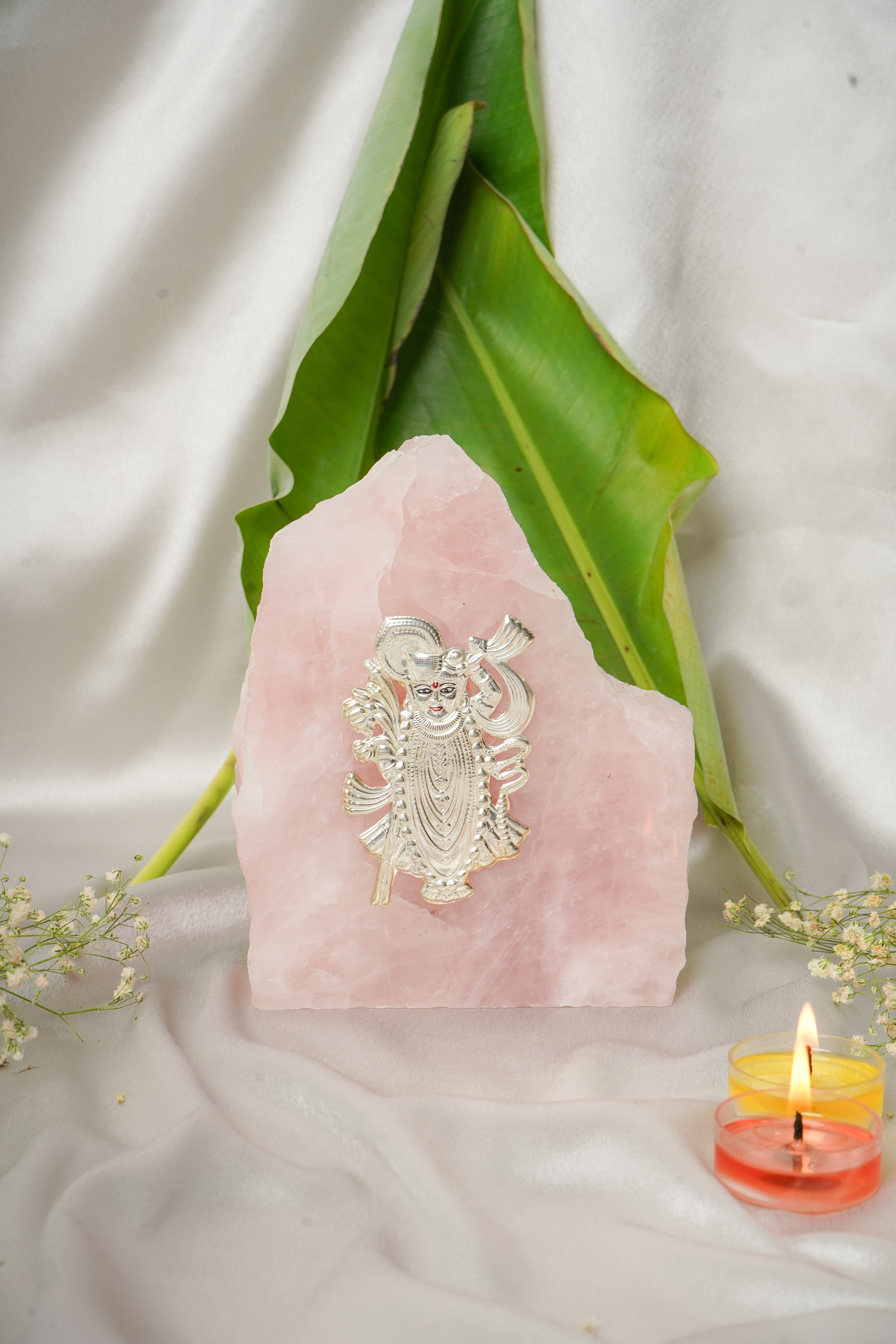 Natural rose quartz stone with pure silver Shrinath Ji pendant, showcasing intricate craftsmanship and vibrant pink gemstone details.