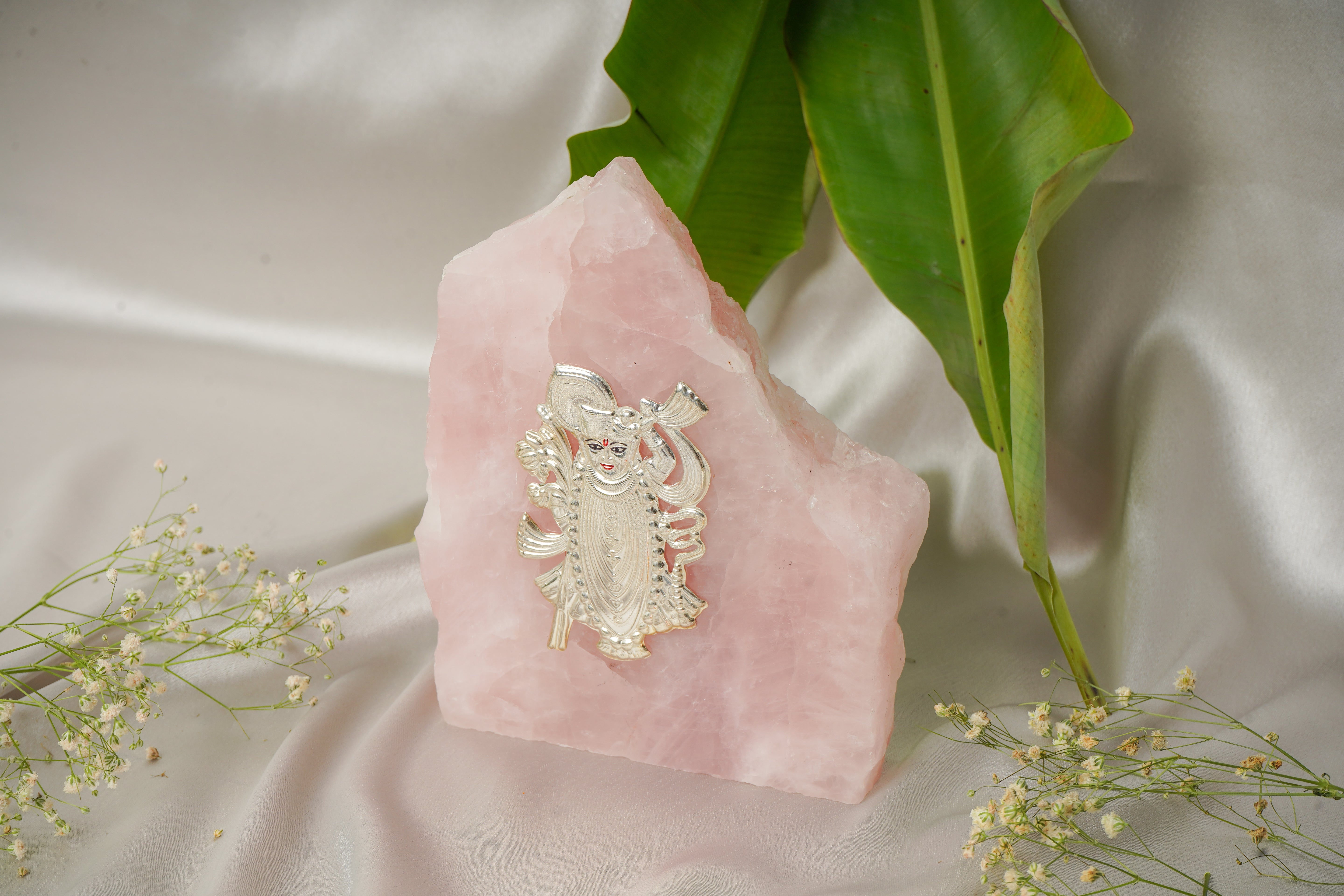 Natural rose quartz stone with pure silver Shrinath Ji pendant, showcasing intricate silver detailing and polished pink quartz.