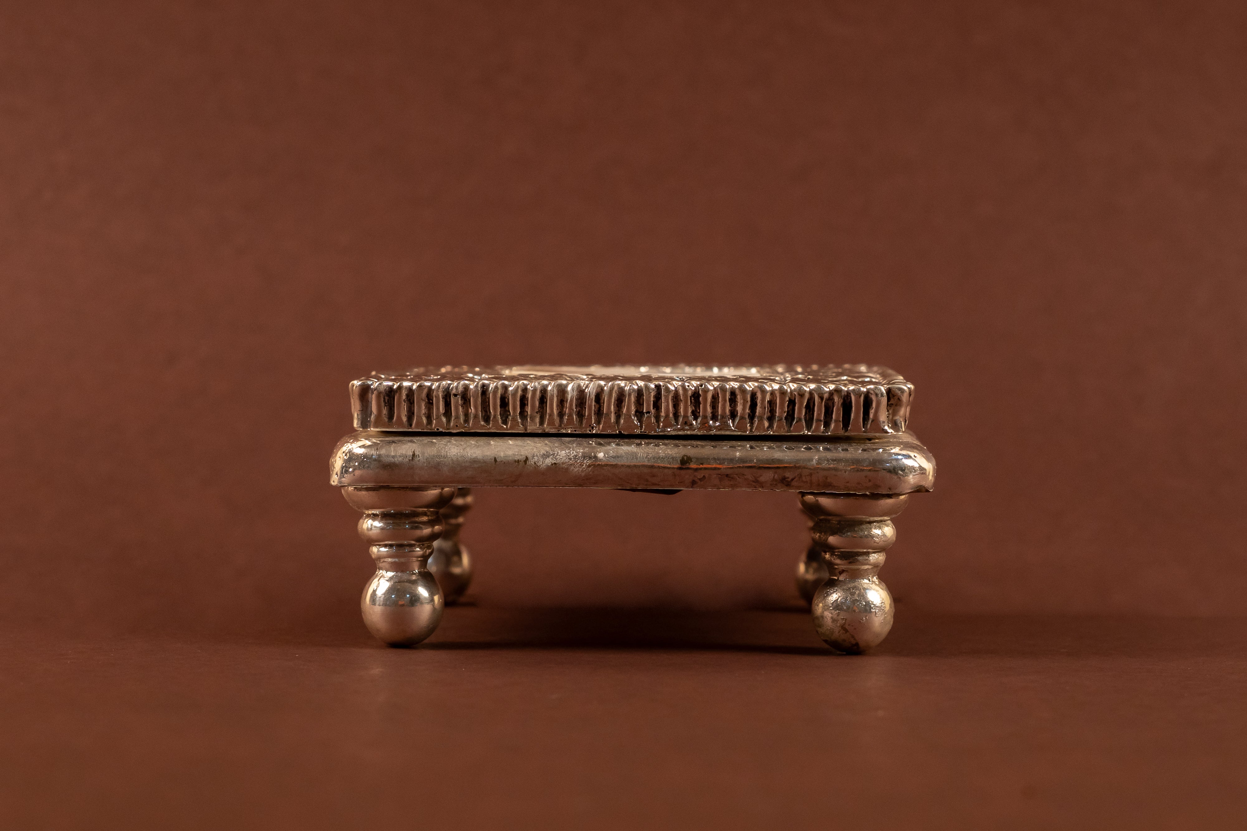 Elegant 999 pure silver MOP Chowki with intricate detailing, crafted by Rasava Jewels, showcasing traditional Indian craftsmanship.