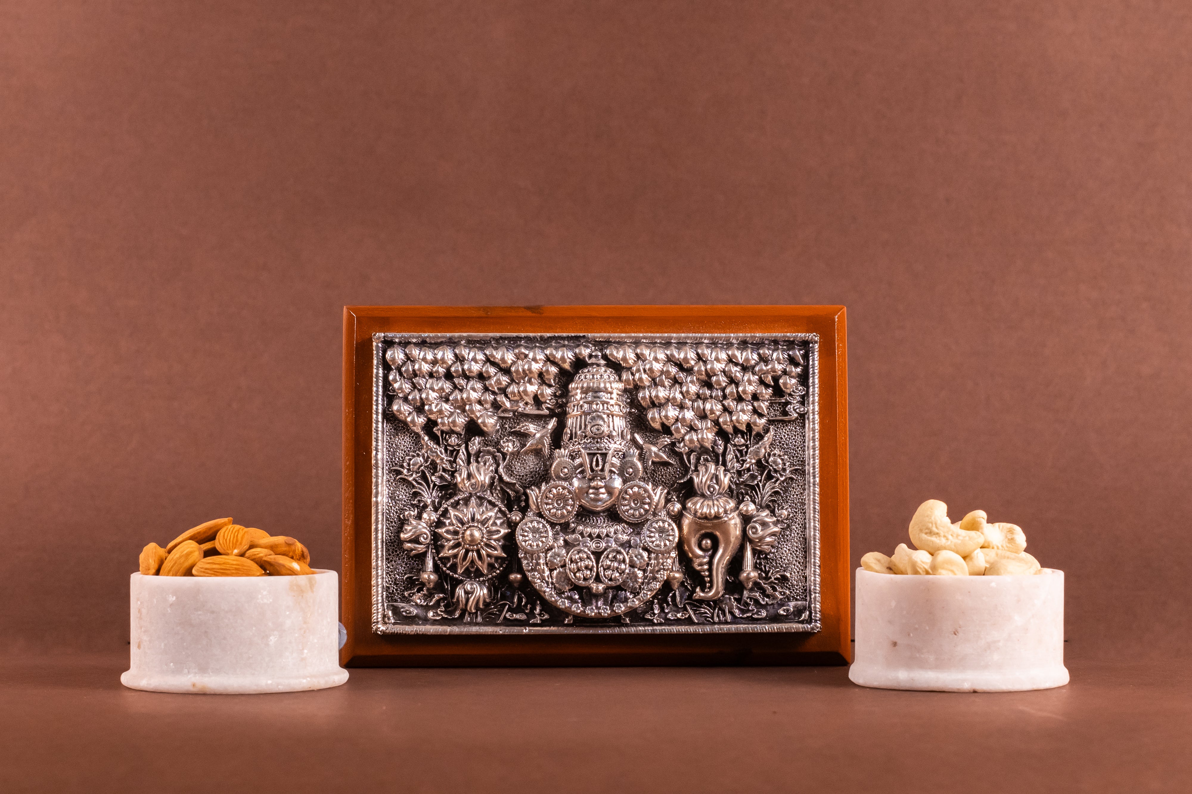 Pure silver Tirupati Balaji dry fruit box by Rasava Jewels, featuring intricate silver craftsmanship and detailed deity design.